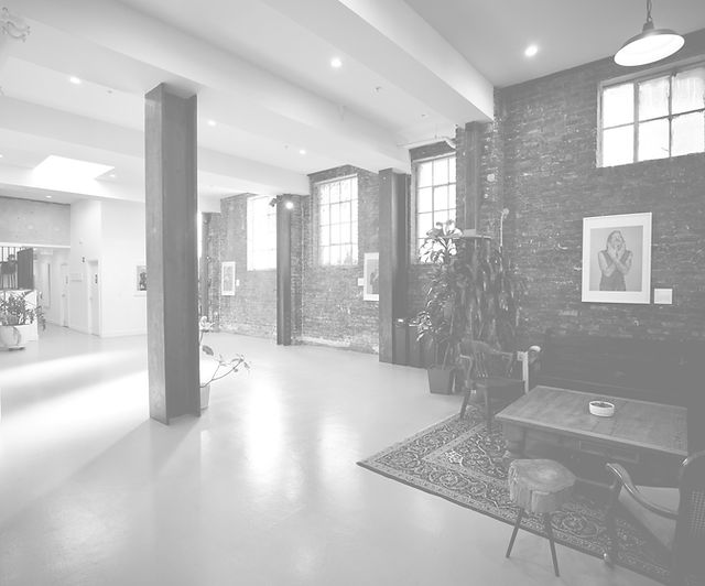 Art gallery with exposed brick walls, ideal for networking events and workshops.