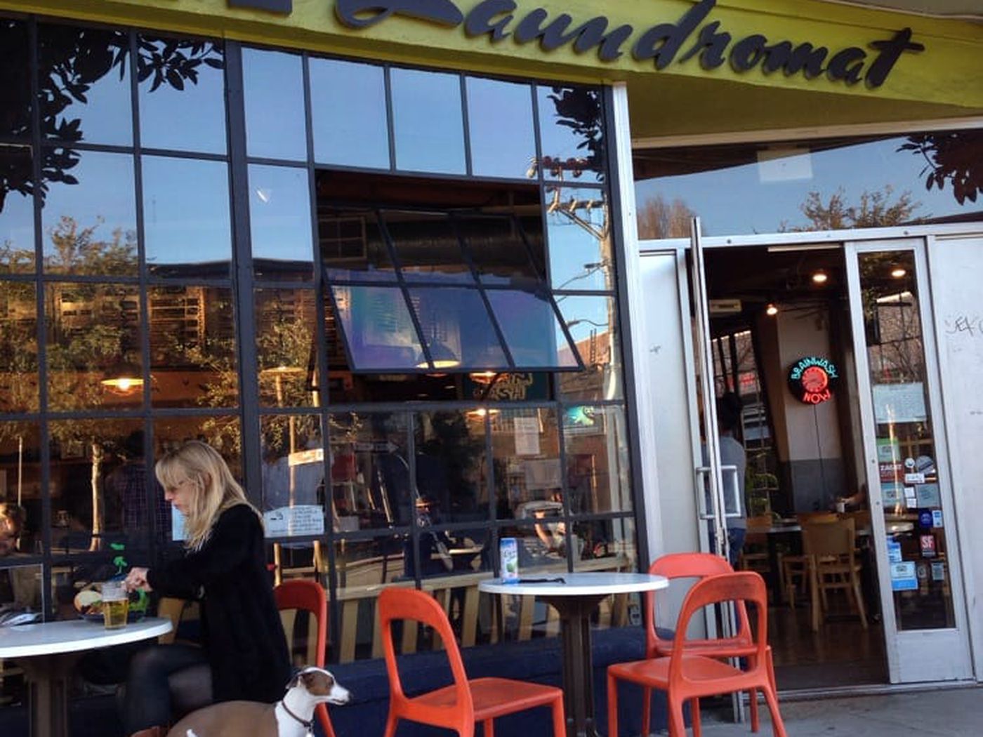 Vibrant café with outdoor seating, perfect for networking events and casual meetings.