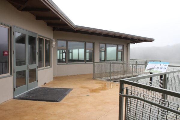 Event venue at Lake Merced Boathouse with large windows for meetings and gatherings.