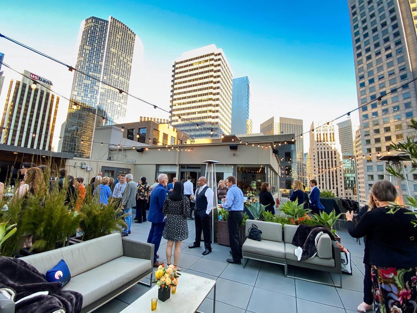 Rooftop patio event with stylish seating, ideal for networking and socializing.
