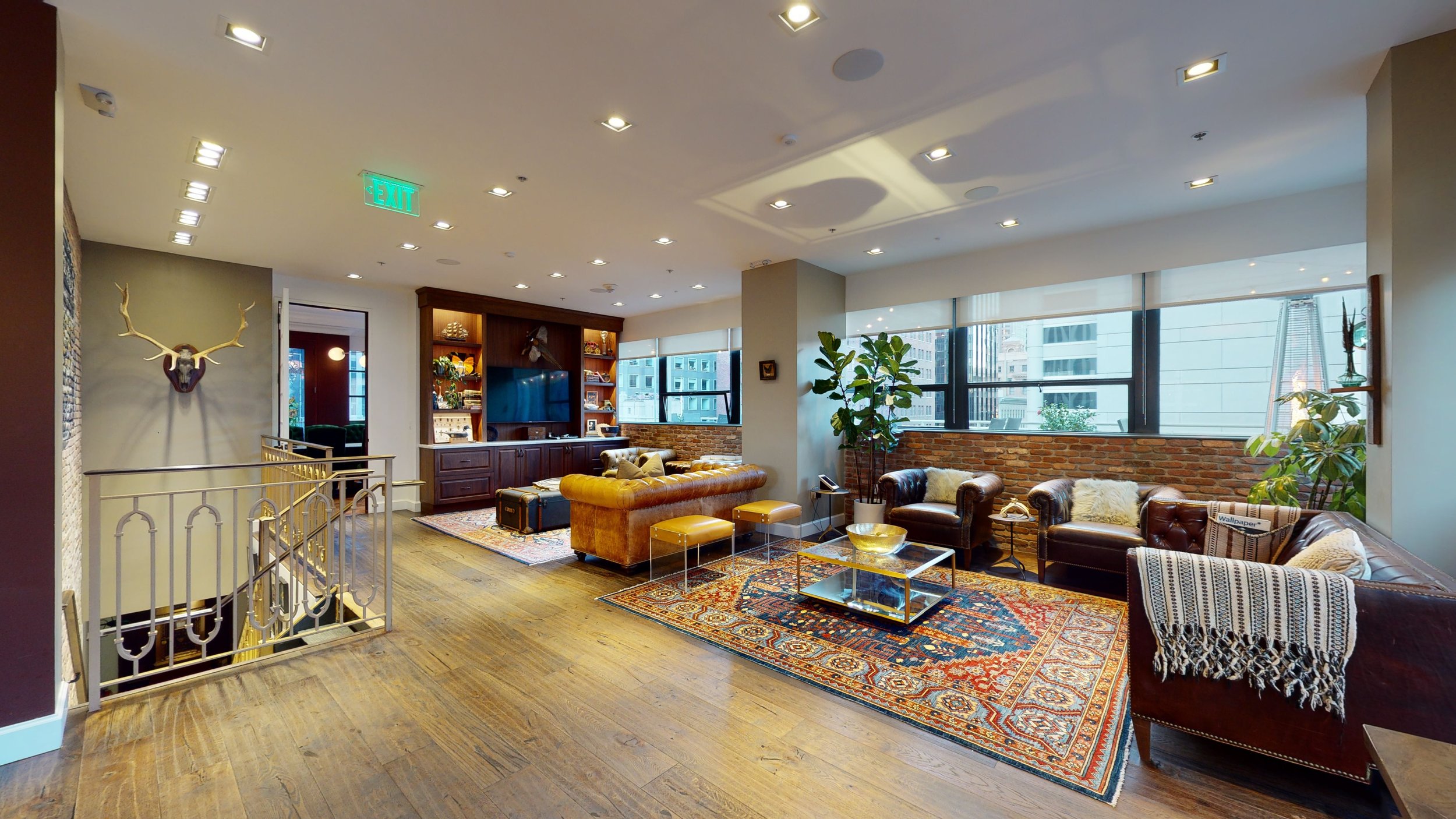 Stylish conference room lounge for networking events with modern decor and comfortable seating.