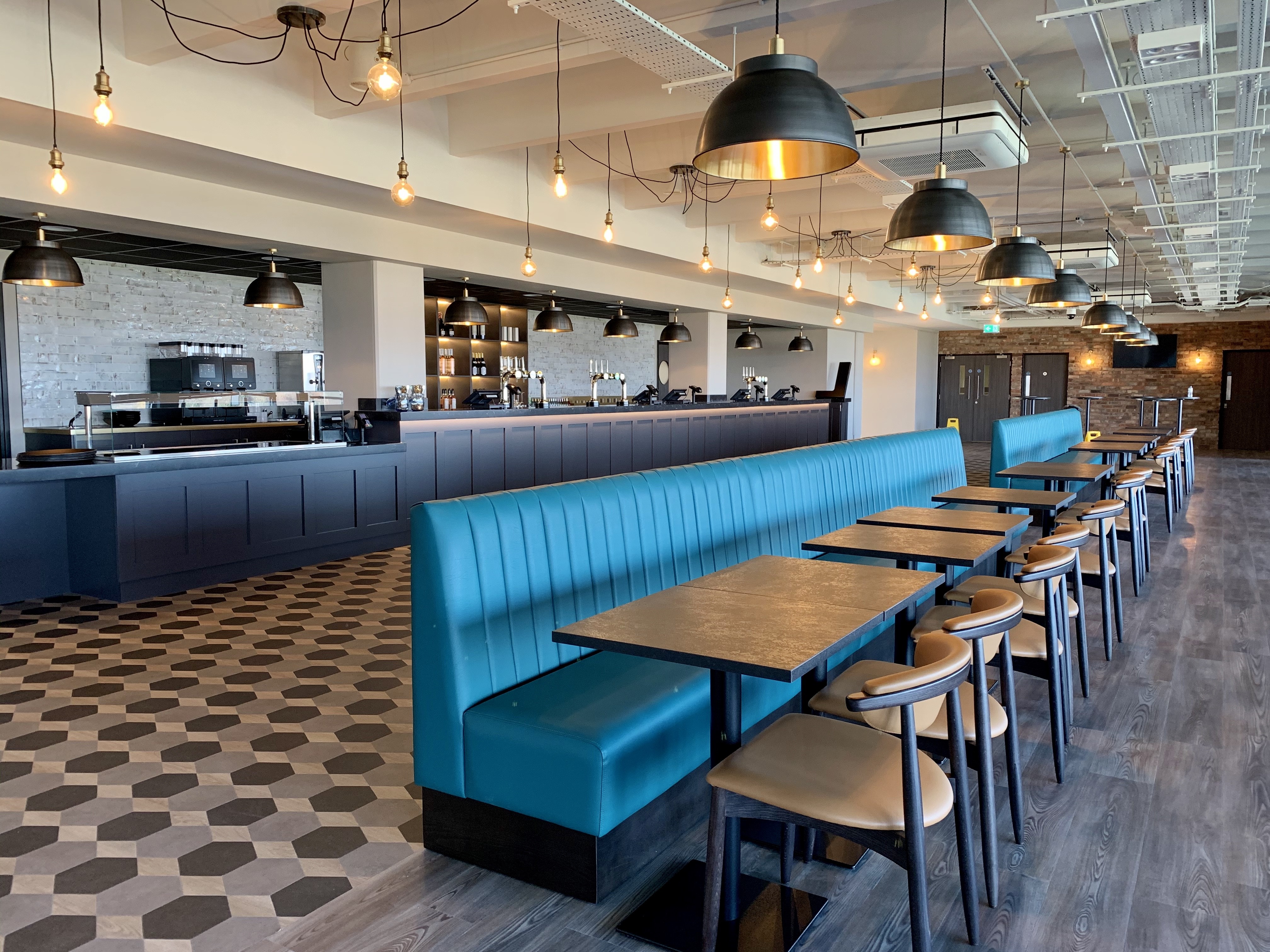 Modern 1875 Lounge at Sandown Park, ideal for events with stylish bar and flexible seating.