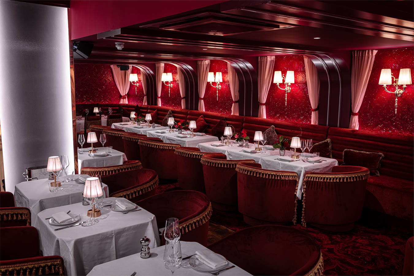 Elegant semi-private dining area with plush seating for upscale events and gatherings.