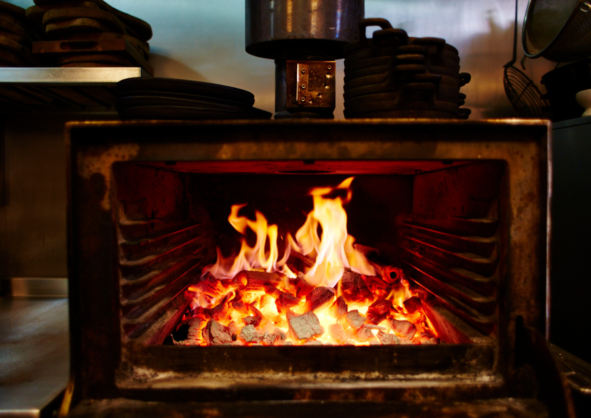 Vibrant fire in Patron Restaurant's Bar & Bistro for engaging culinary events.