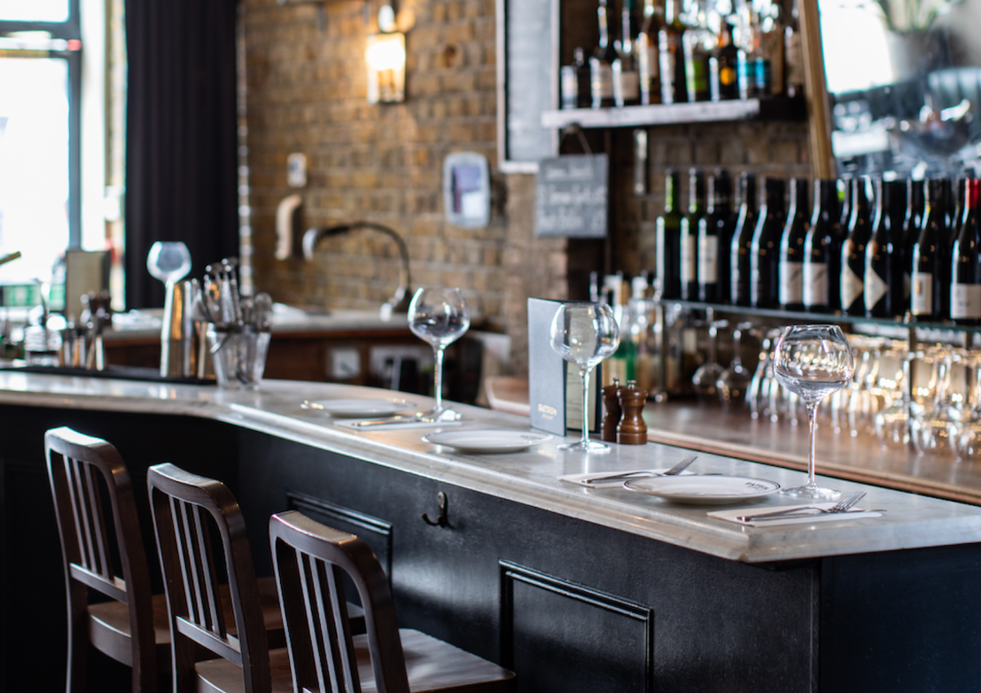 Stylish bar setup at Patron Restaurant, ideal for intimate gatherings and networking events.