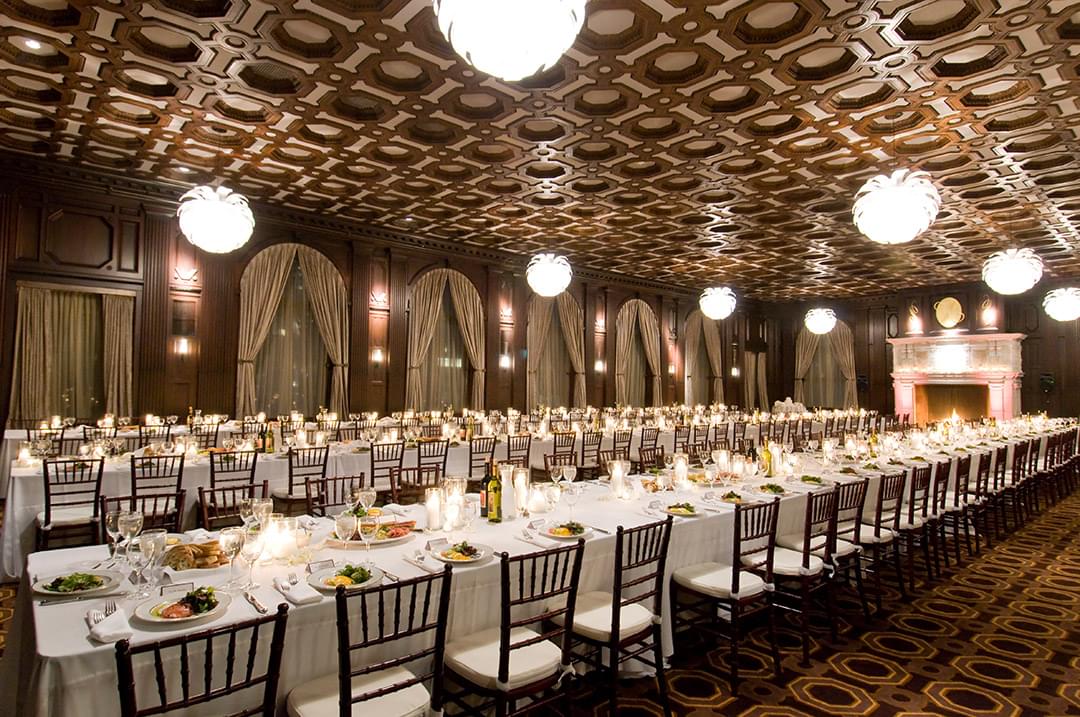 Elegant banquet hall with white linens, ideal for weddings and corporate events.