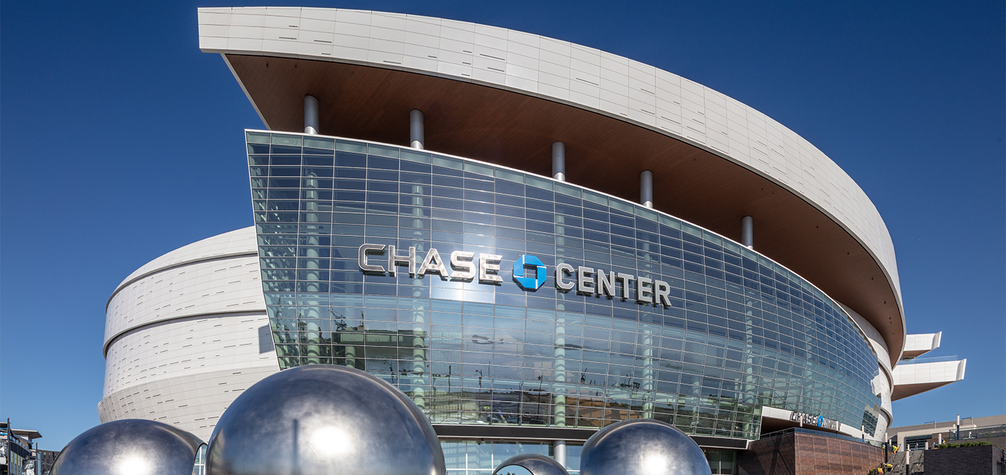 Chase Center arena with sleek glass facade, perfect for corporate and entertainment events.