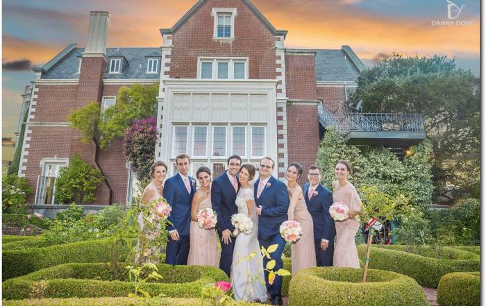 Elegant wedding party at Kohl Mansion's lush garden, perfect for outdoor ceremonies.