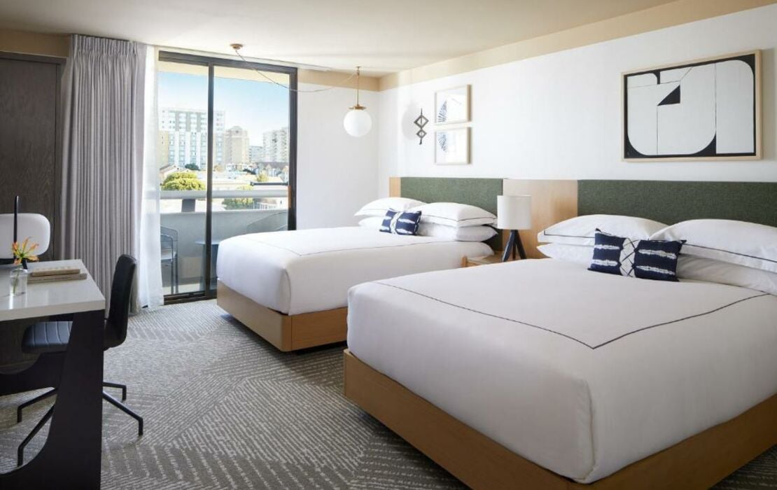 Modern Japantown Hotel room with two beds, ideal for events and conferences.
