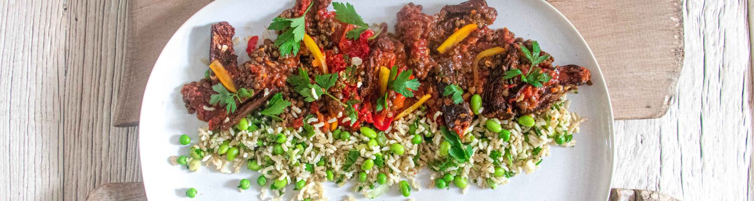Vibrant beef dish with bell peppers and rice at The W Bar, perfect for events and catering.