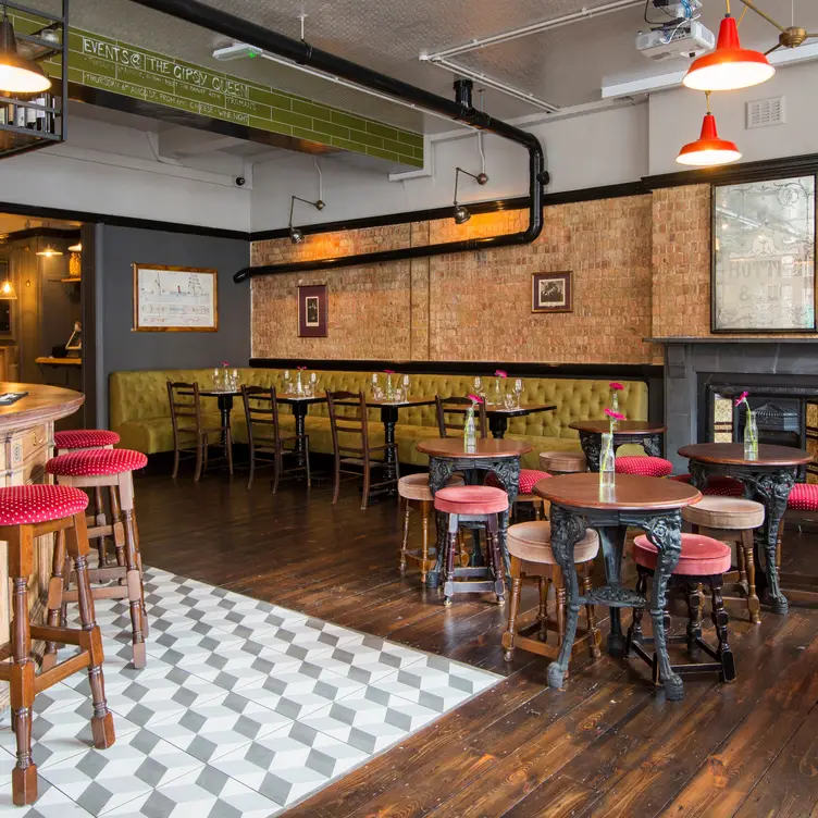 Stylish studio venue with cozy seating for intimate gatherings and networking events.