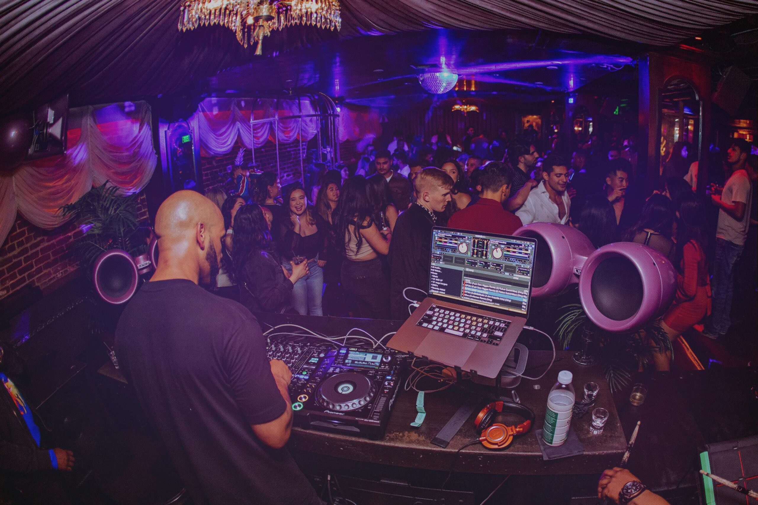 "Bonaparte Room at Hawthorn SF: DJ energizes vibrant nightlife event with lively crowd."