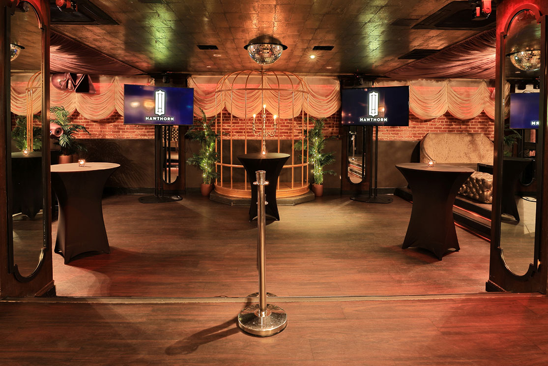 Main Room at Hawthorn SF: sleek cocktail tables for stylish networking events.