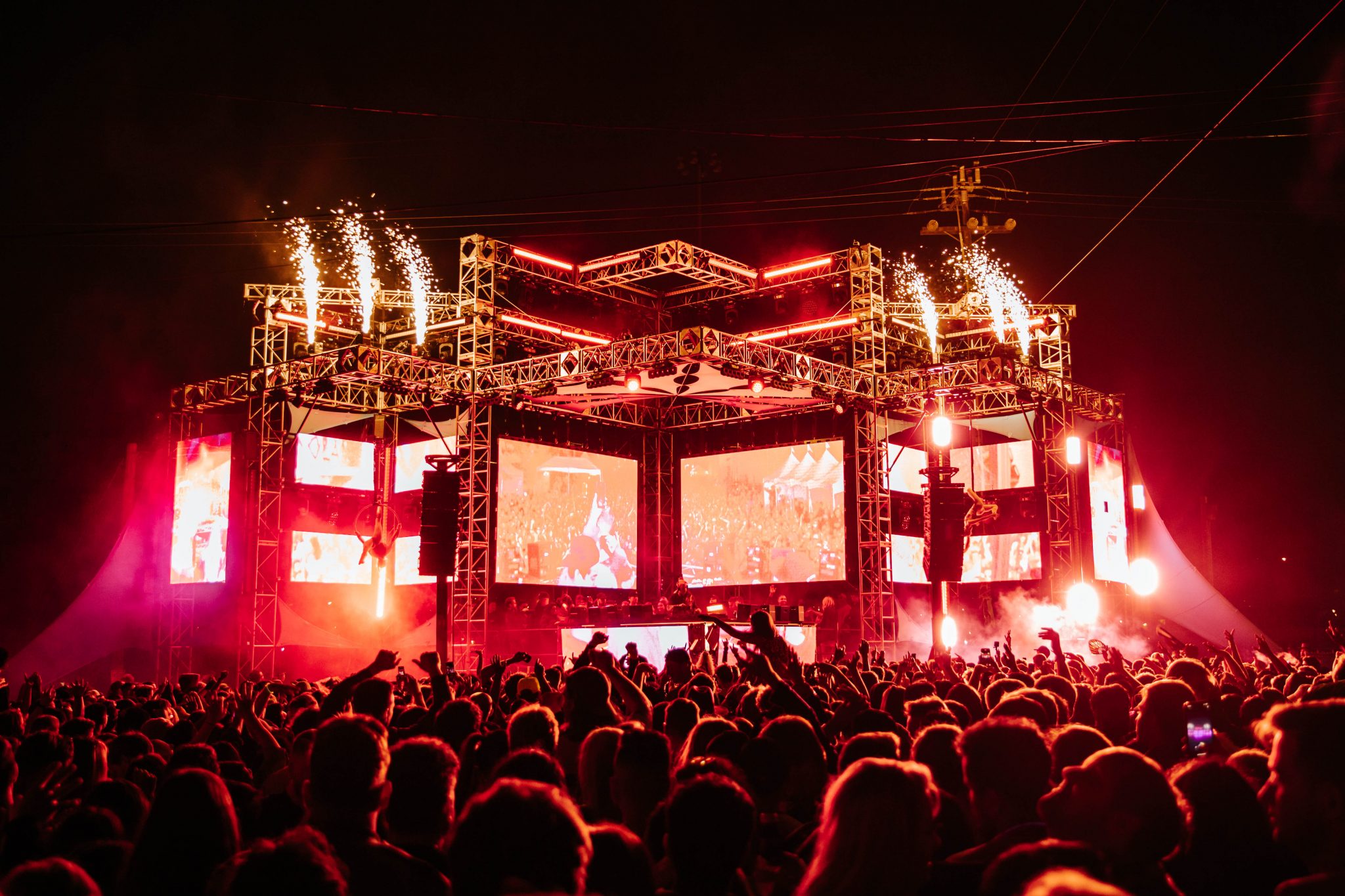 Vibrant outdoor event at The Midway with dynamic stage and crowd excitement.