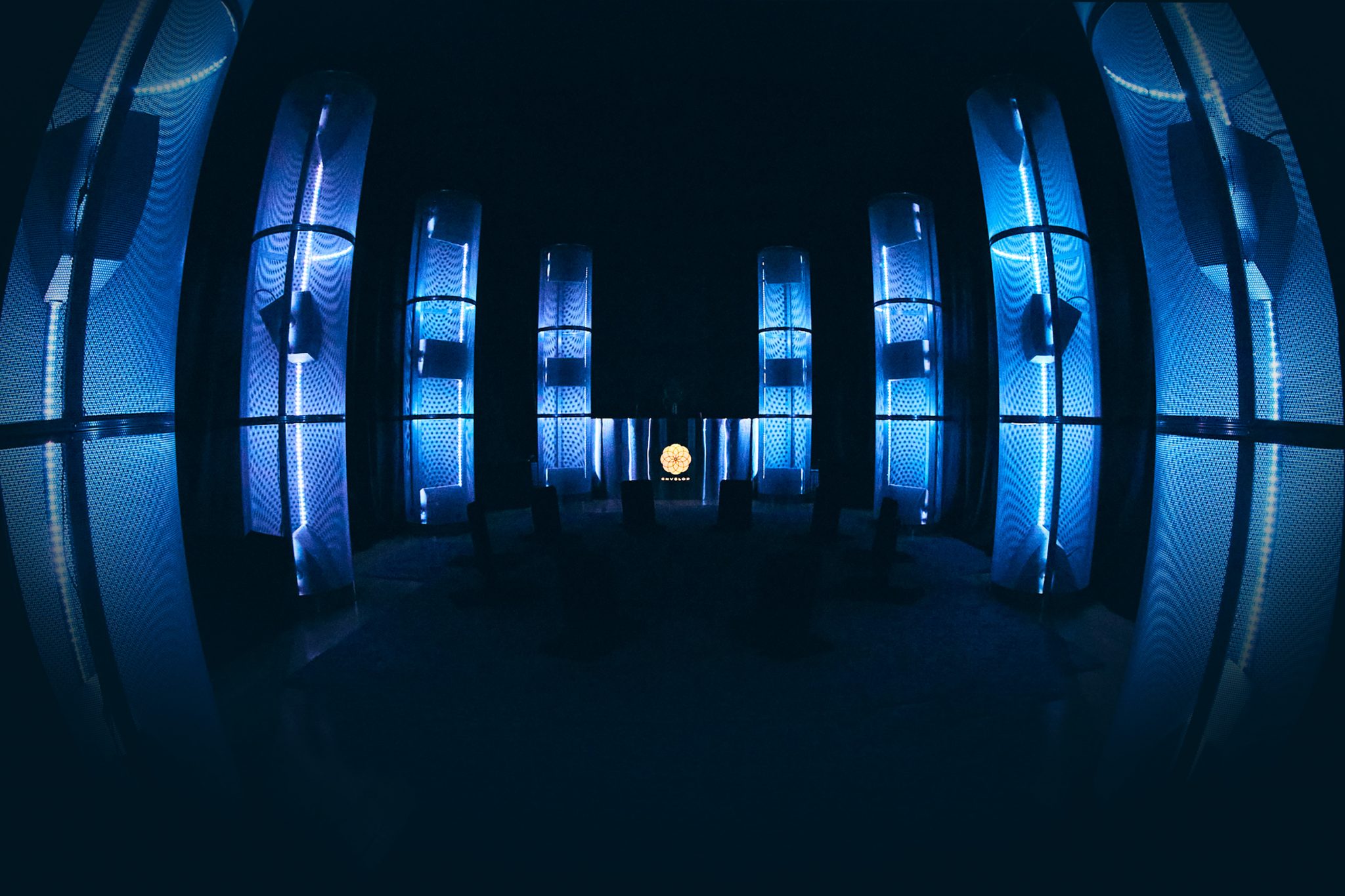 Modern event space with illuminated panels, ideal for presentations and networking.