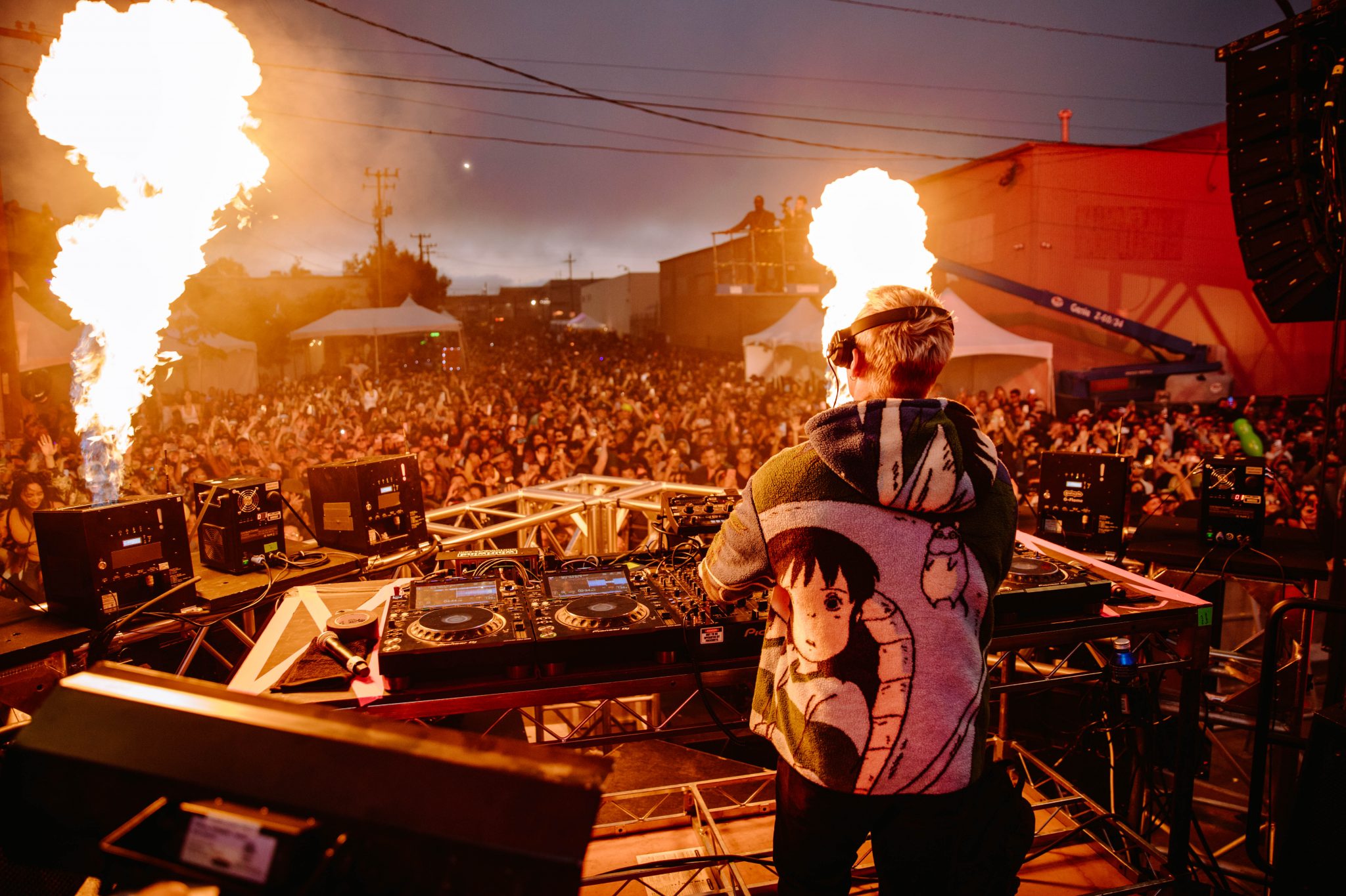 Block Party in The Midway with DJ and pyrotechnics, vibrant outdoor event entertainment.