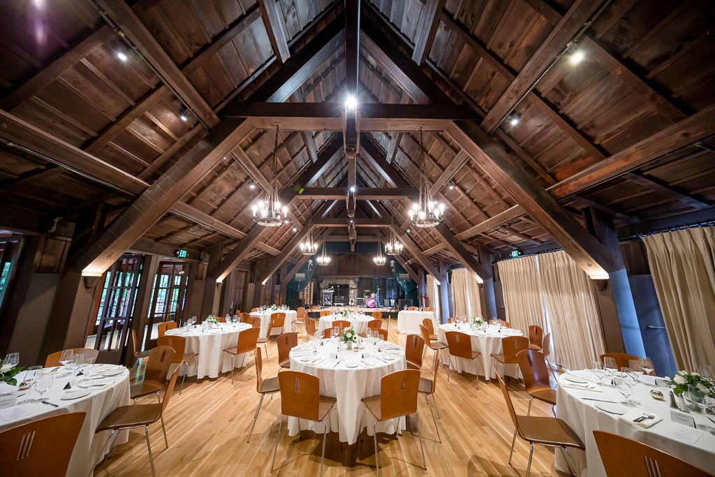 Elegant reception hall with round tables, perfect for weddings and corporate events.