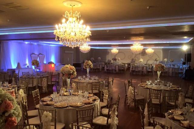 Elegant wedding venue in Norwalk with luxurious chandeliers and floral centerpieces.