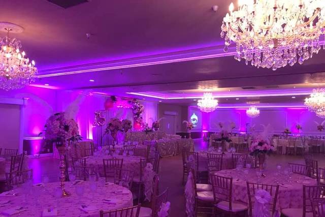 Elegant wedding venue in Norwalk with chandeliers and floral centerpieces.
