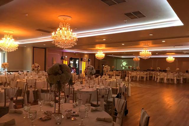 Elegant banquet hall with chandeliers, perfect for weddings and formal events.