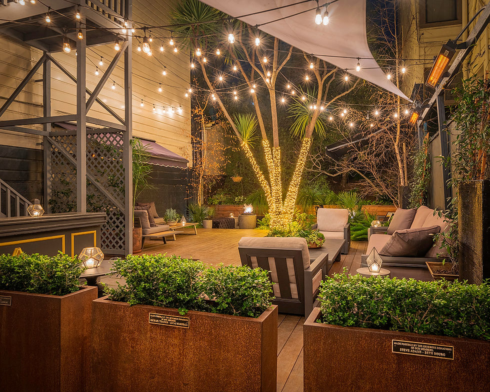 Outdoor event space at The Academy SF with string lights, ideal for gatherings and networking.