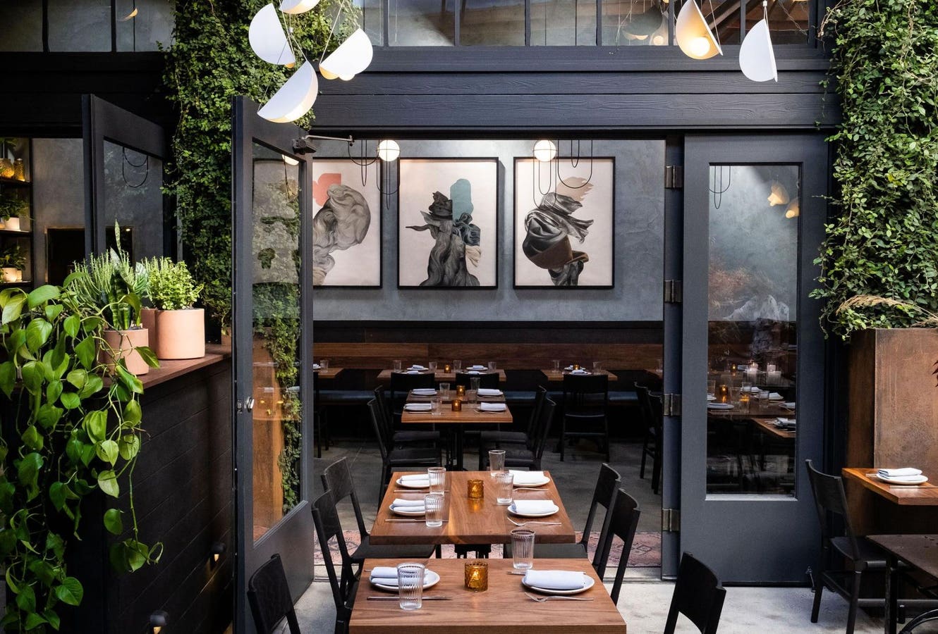 Private dining room at Penny Roma with modern art, ideal for corporate events and gatherings.