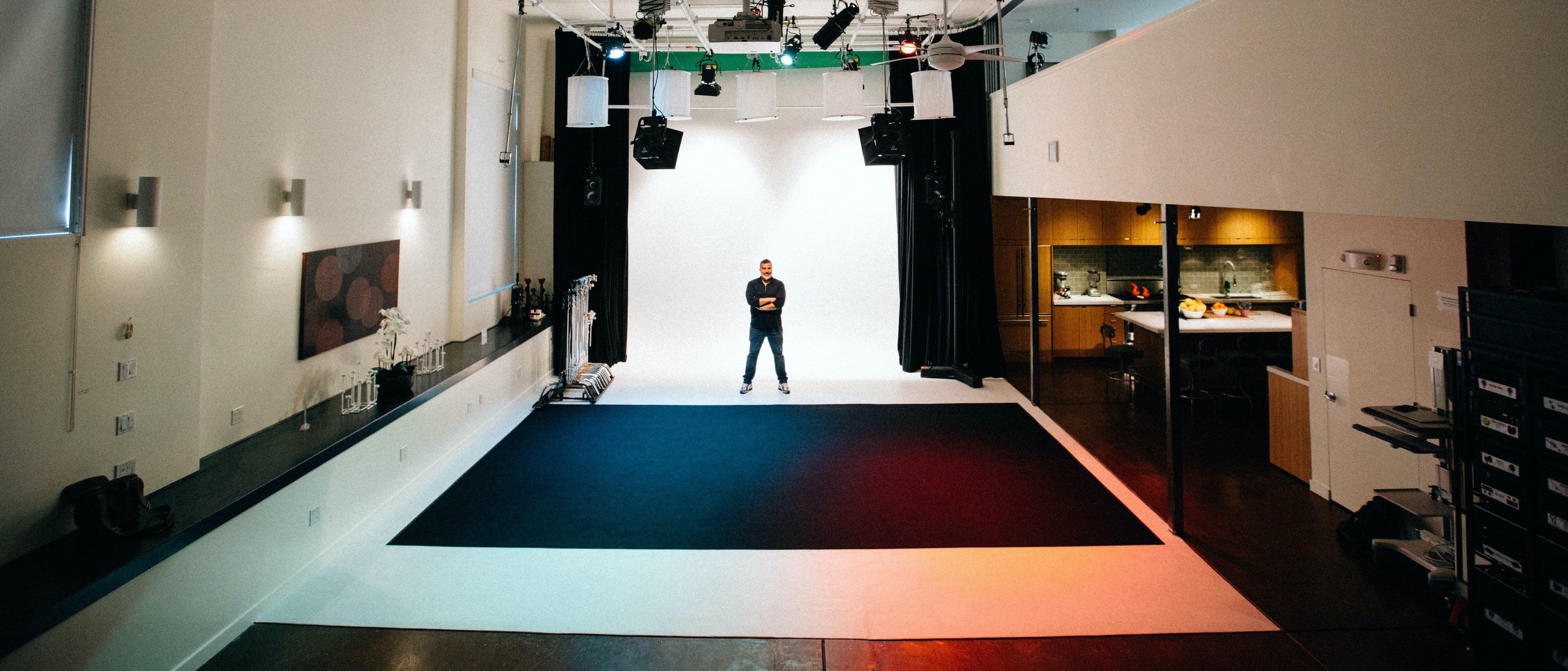 Versatile Black Limbo event space with clean backdrop for presentations and performances.