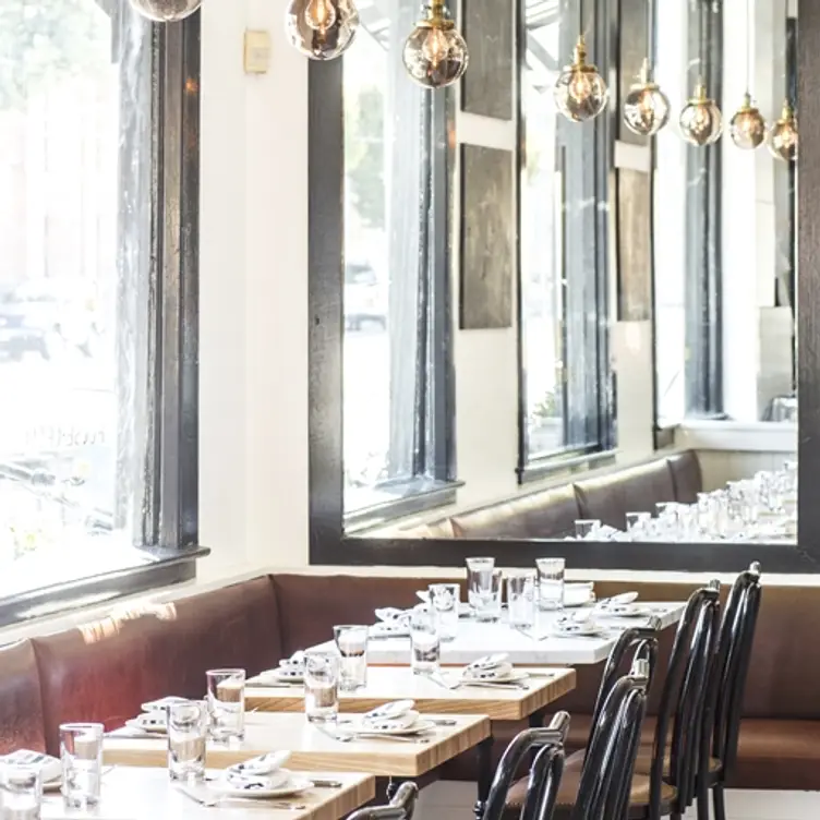 Stylish communal table in Marlowe, perfect for intimate gatherings and corporate events.