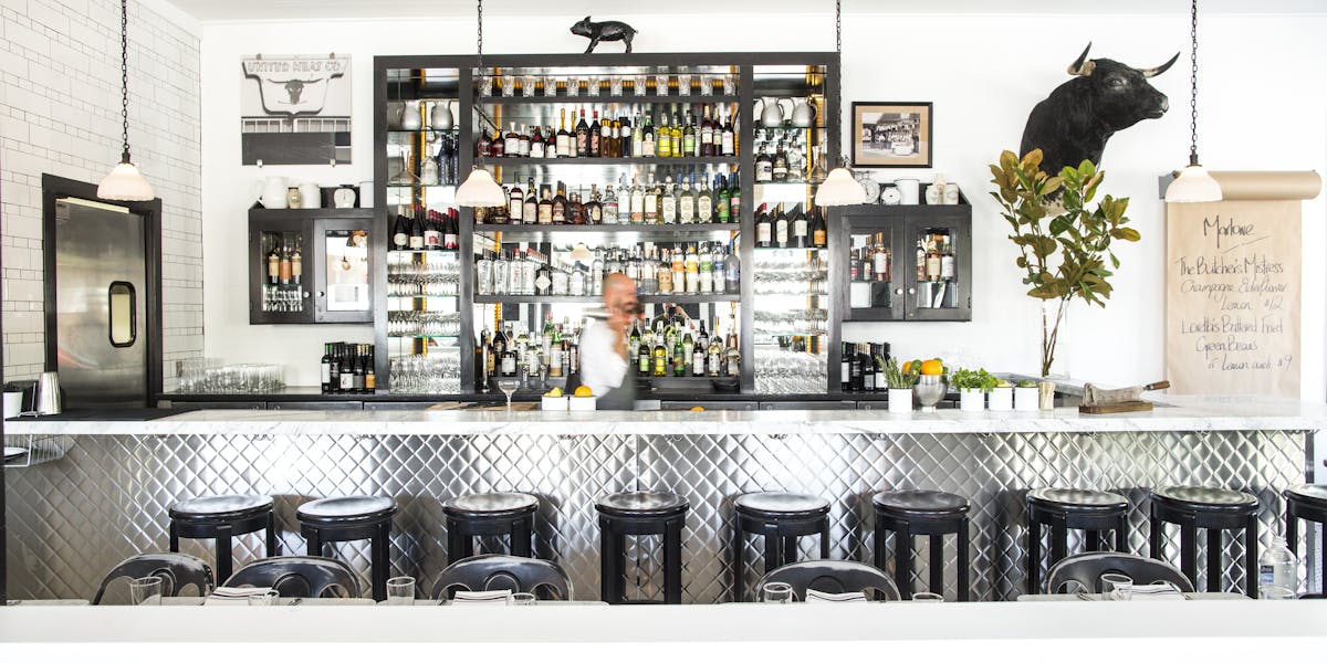 Stylish bar area at Full Buyout in Marlowe, perfect for networking events and gatherings.