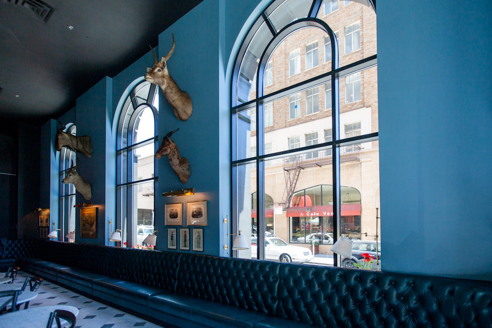 Stylish Blue Bar venue with arched windows, perfect for events and meetings.