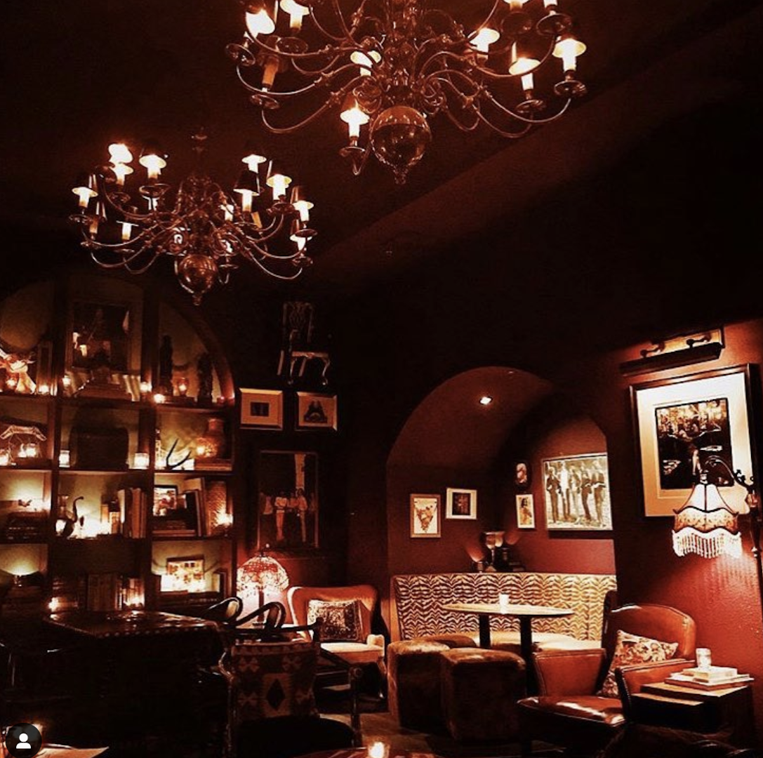 Intimate speakeasy venue with warm lighting, perfect for cocktail receptions and private events.