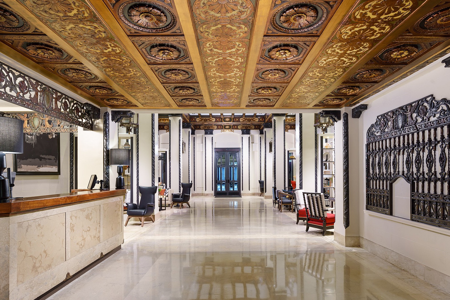 Luxurious Hotel Spero lobby with ornate ceiling, perfect for high-end events and gatherings.