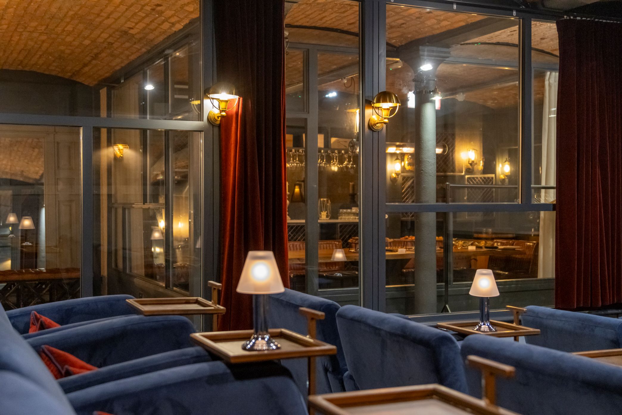 Sophisticated event space with plush seating at The Cellars, ideal for gatherings and networking.