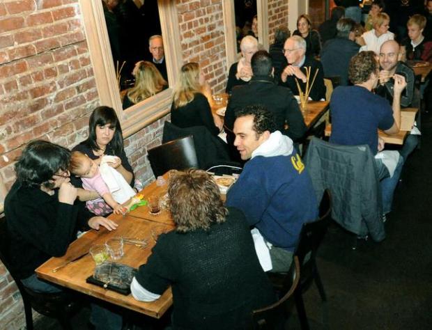 Lively Marzano Restaurant with brick walls, perfect for networking events and gatherings.