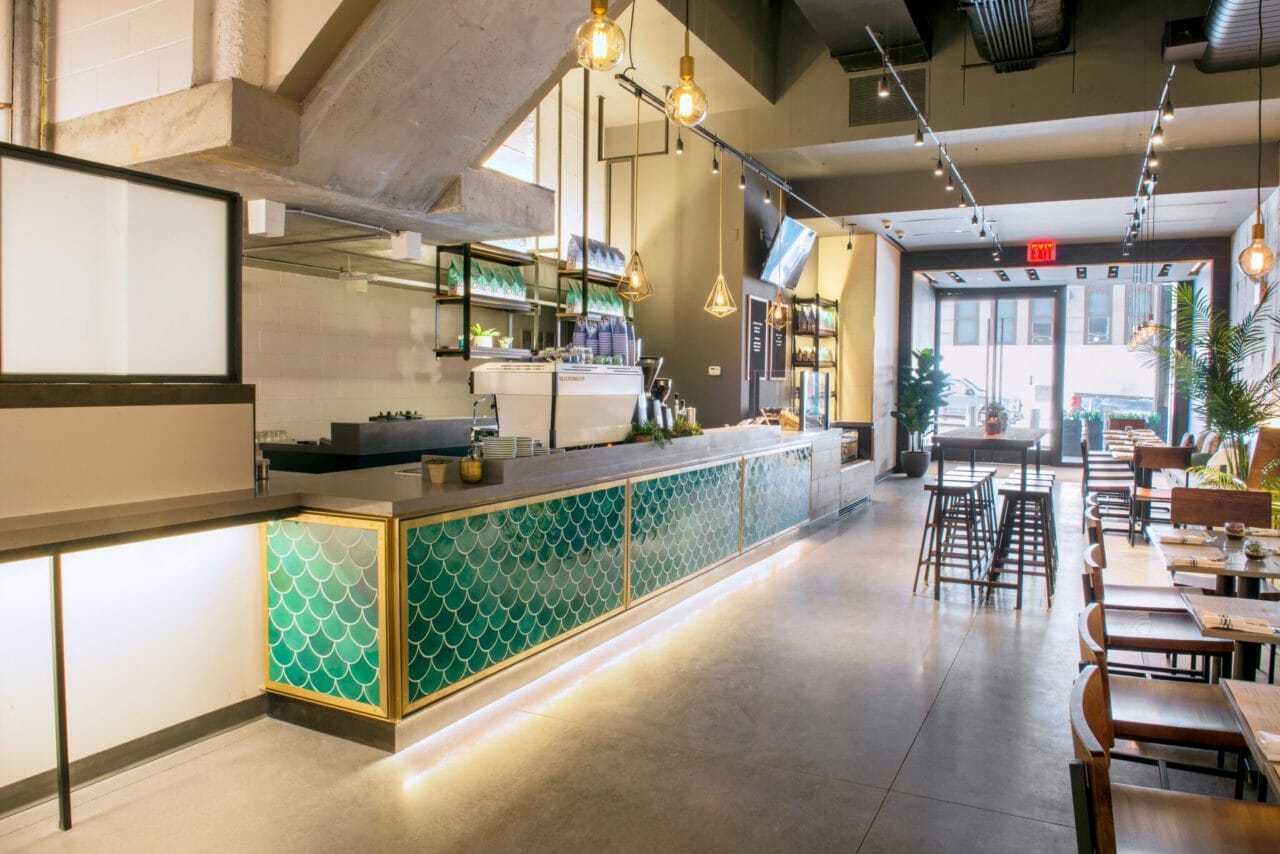 Modern café Roastery in Bluestone Lane, ideal for networking and informal meetings.