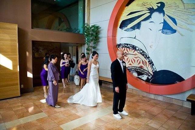 Wedding at Hotel Kabuki with bride in elegant gown and artistic mural backdrop.