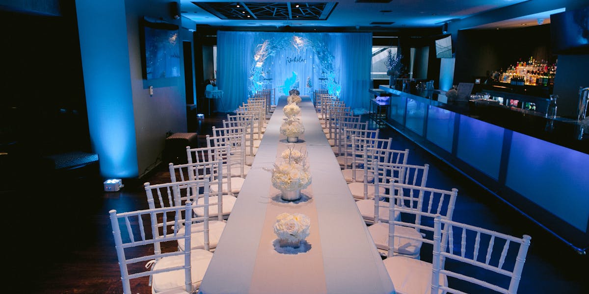 Elegant banquet hall with floral centerpieces for weddings and corporate events.