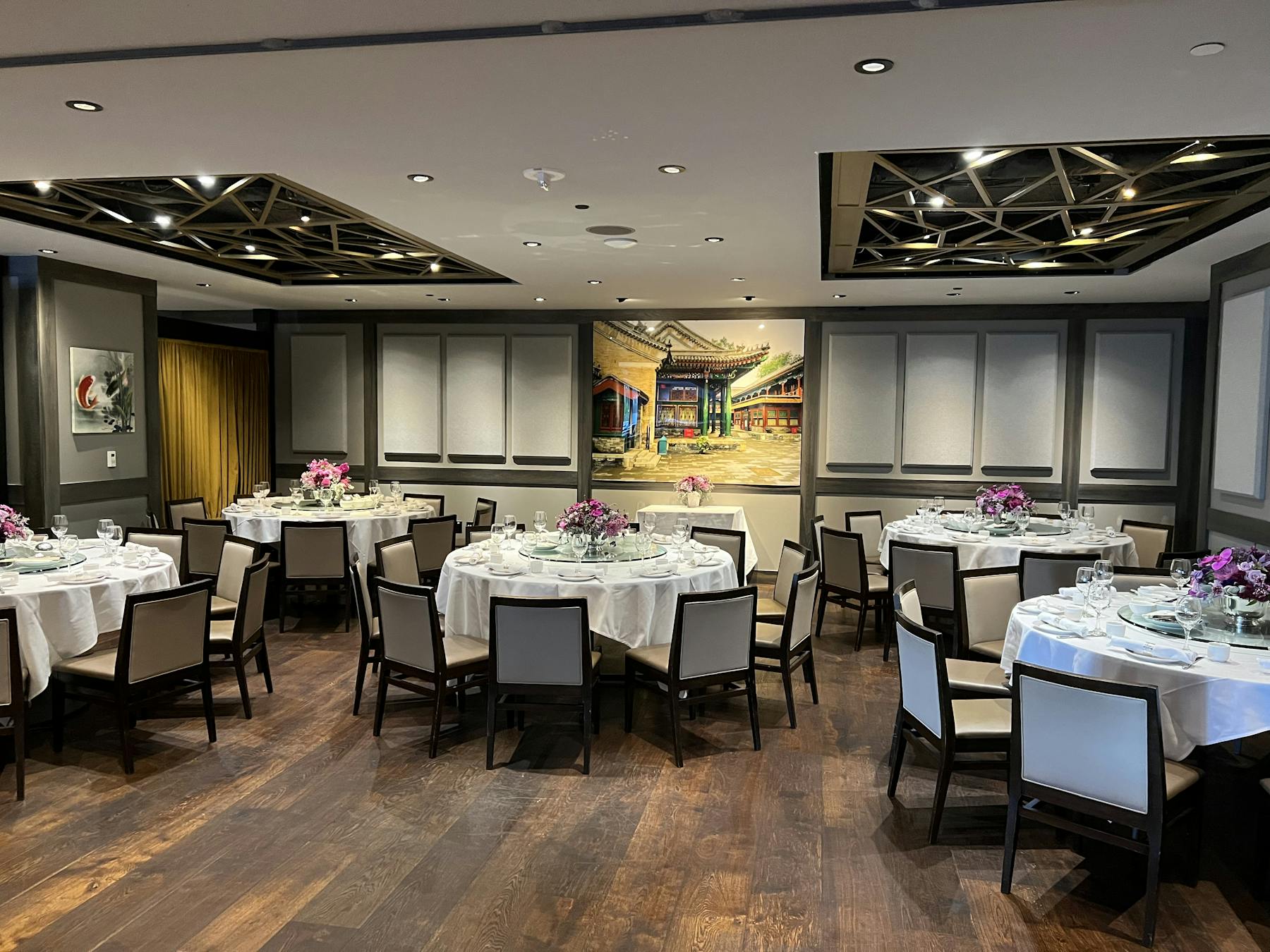 Elegant banquet hall with floral centerpieces, perfect for corporate meetings and celebrations.