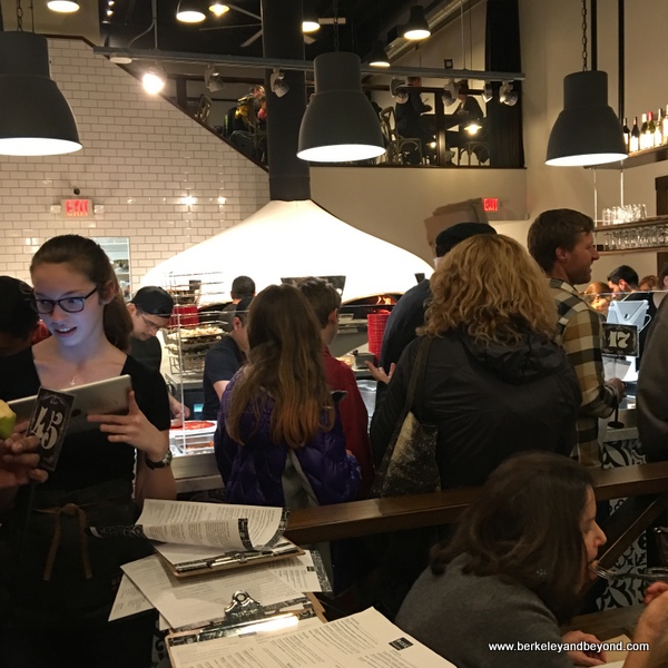 Main Floor Dining at Rise Pizzeria, lively event space for networking and receptions.