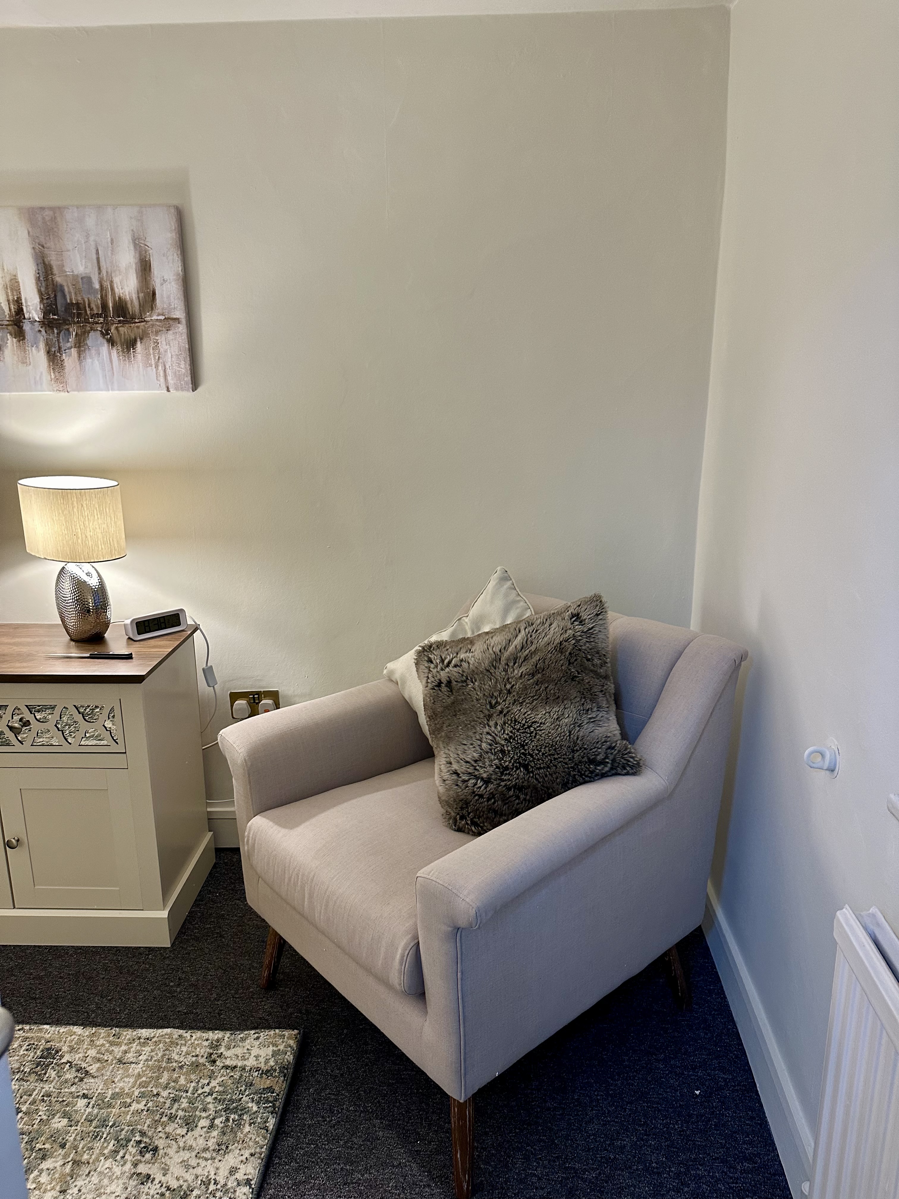 Cozy seating area in The Pilgrim Suite, ideal for meetings and collaboration.