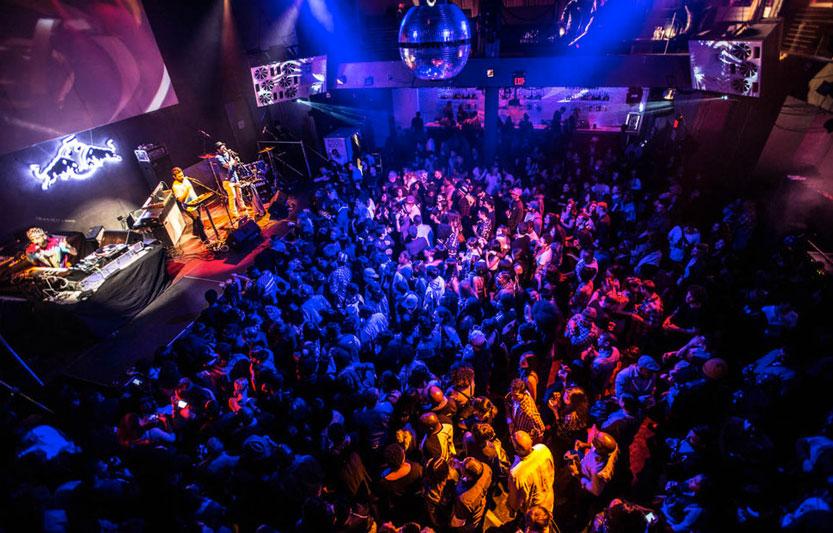 Vibrant crowd enjoying live music at 1015 Folsom event with dynamic lighting.