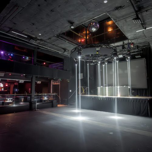 Versatile event space at 1015 Folsom with sleek stage, ideal for corporate events and gatherings.