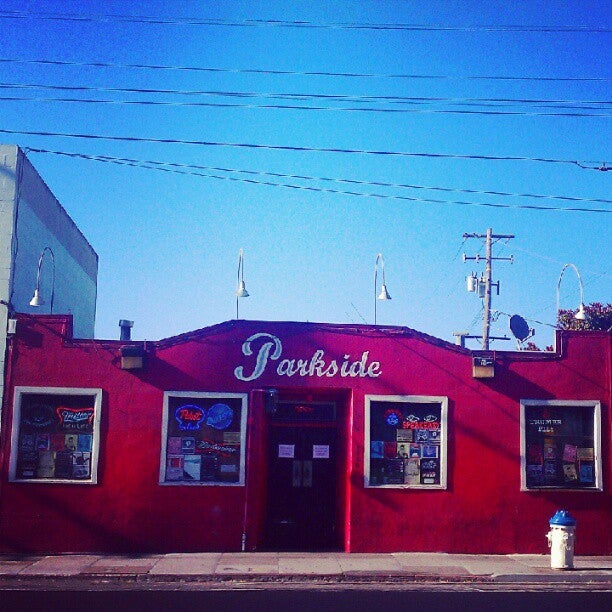 Vibrant red venue, Coffee in Thee Parkside, ideal for casual gatherings and networking events.