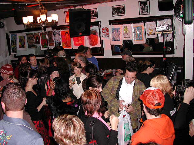 Lively networking event at Coffee in Thee Parkside with vibrant decor and warm lighting.