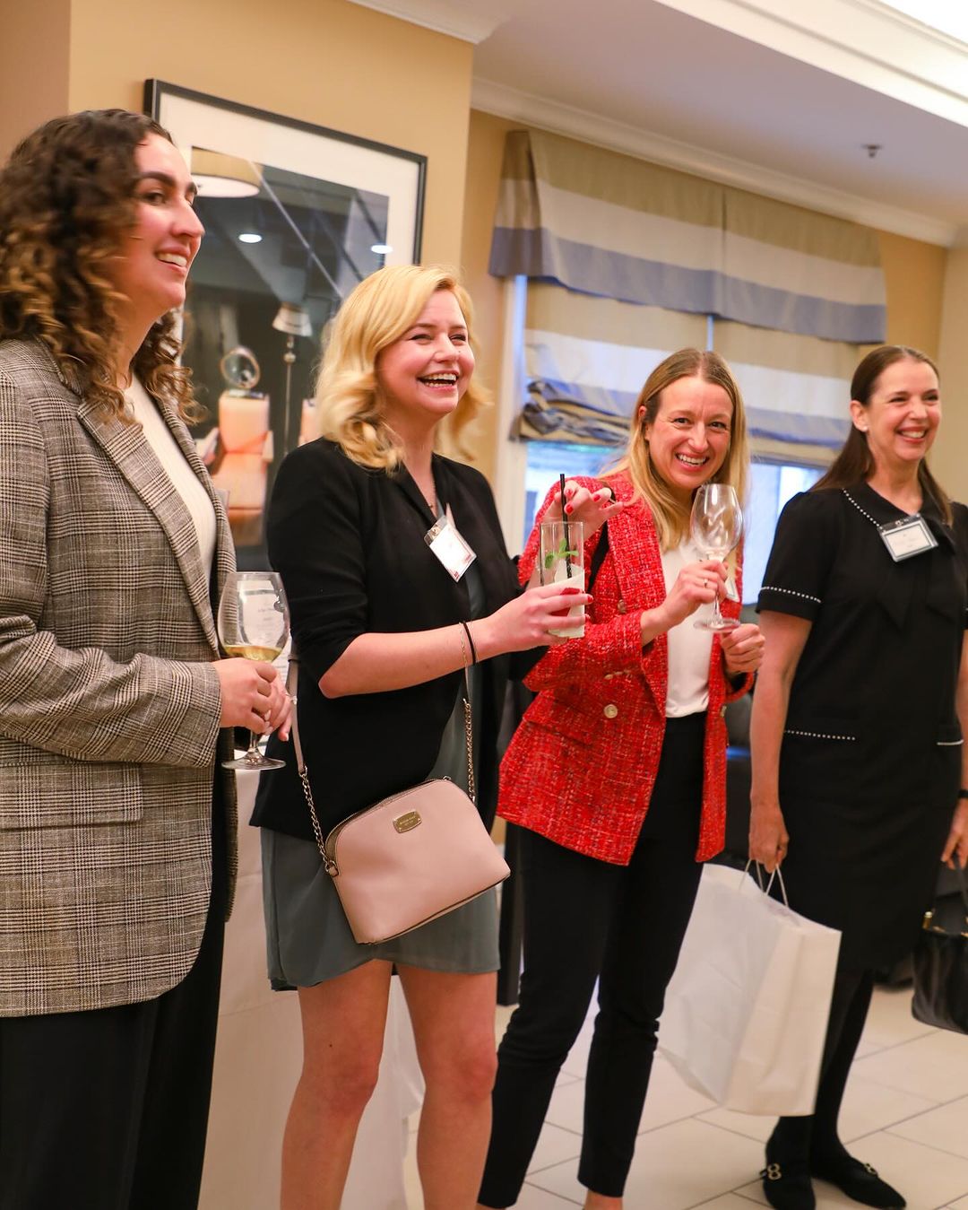 Lively networking event at M Spa, featuring engaged attendees and a warm atmosphere.