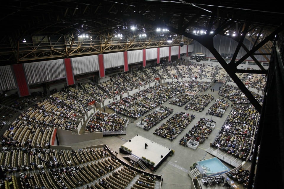 Exposition Center at Cow Palace Arena, showcasing a large event with organized seating.
