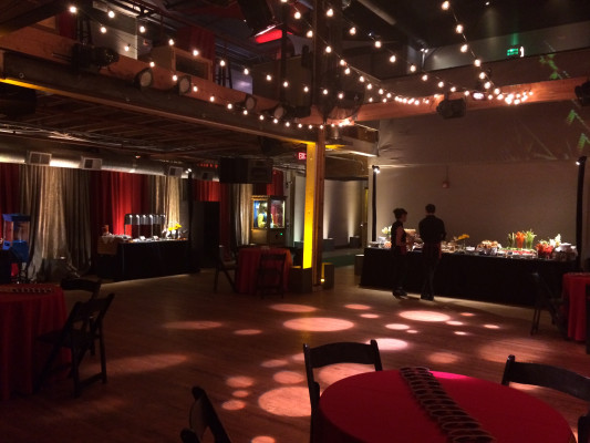 Event space at LOCAL 161 SF with red linens, ideal for networking and celebrations.