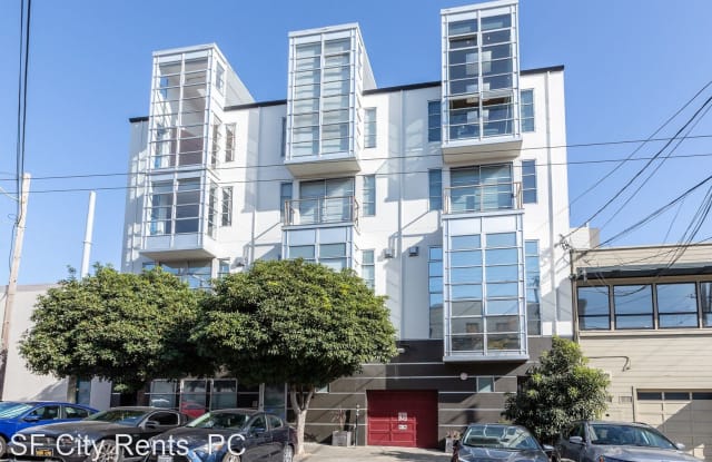 Modern multi-story event venue with large windows in Mission Loft, perfect for gatherings.
