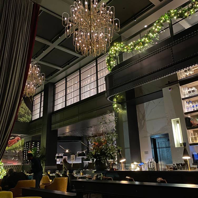 Sophisticated events venue with elegant chandeliers, ideal for upscale gatherings.