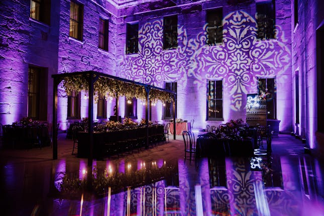 Elegant event venue in The Commons SF with purple lighting, perfect for weddings and corporate events.
